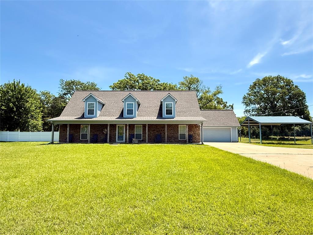 720 Haggerty Road Karnack, TX 75661 - Photo 2 of 39 a view of house with outdoor space and swimming pool