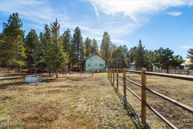 a kitchen with a sink appliances and cabinets