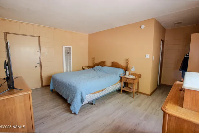 a bathroom with a shower and a sink