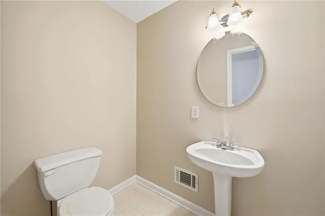 a bathroom with a shower and a toilet