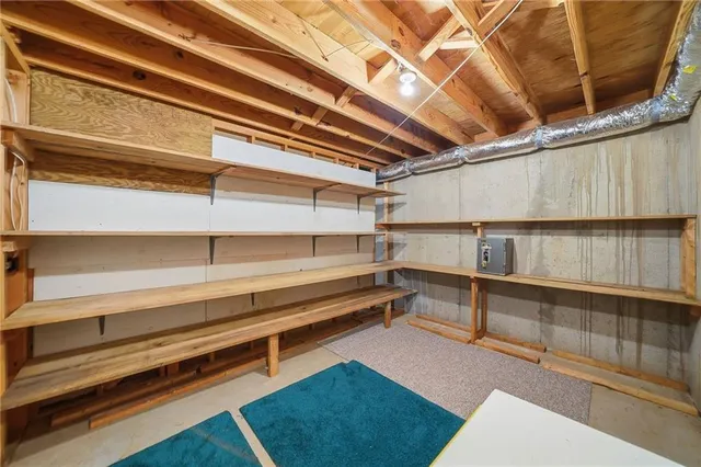 a view of a livingroom with furniture and a window