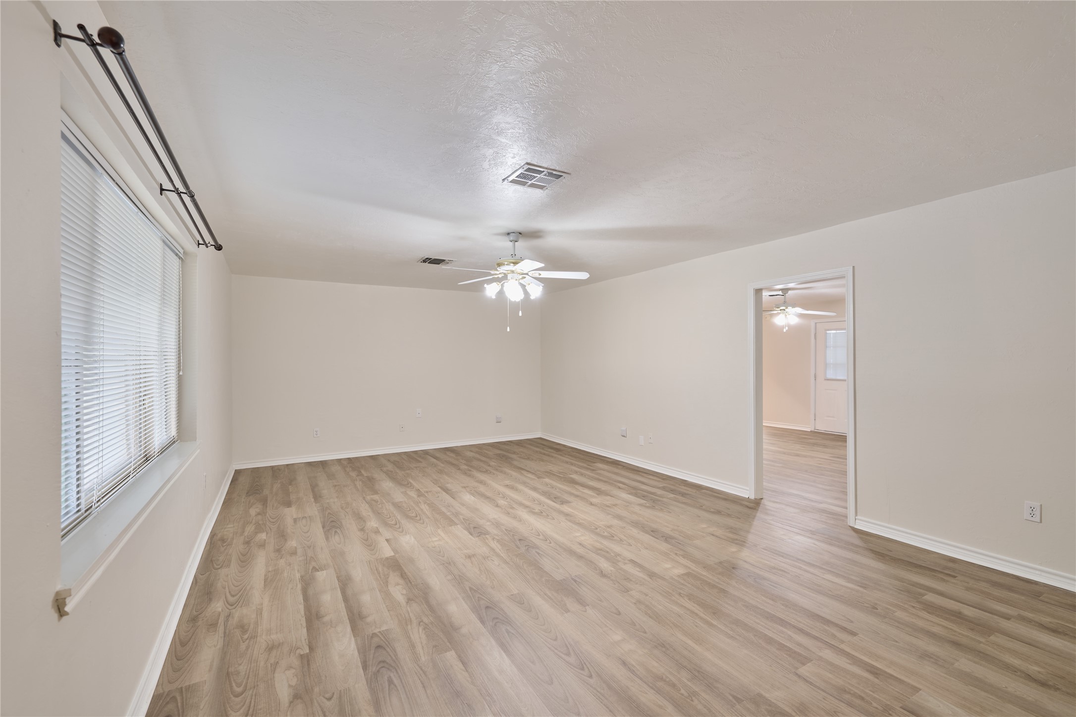 21807 Greengate Drive Spring, TX 77388 - Photo 12 of 44 wooden floor in an empty room with a window