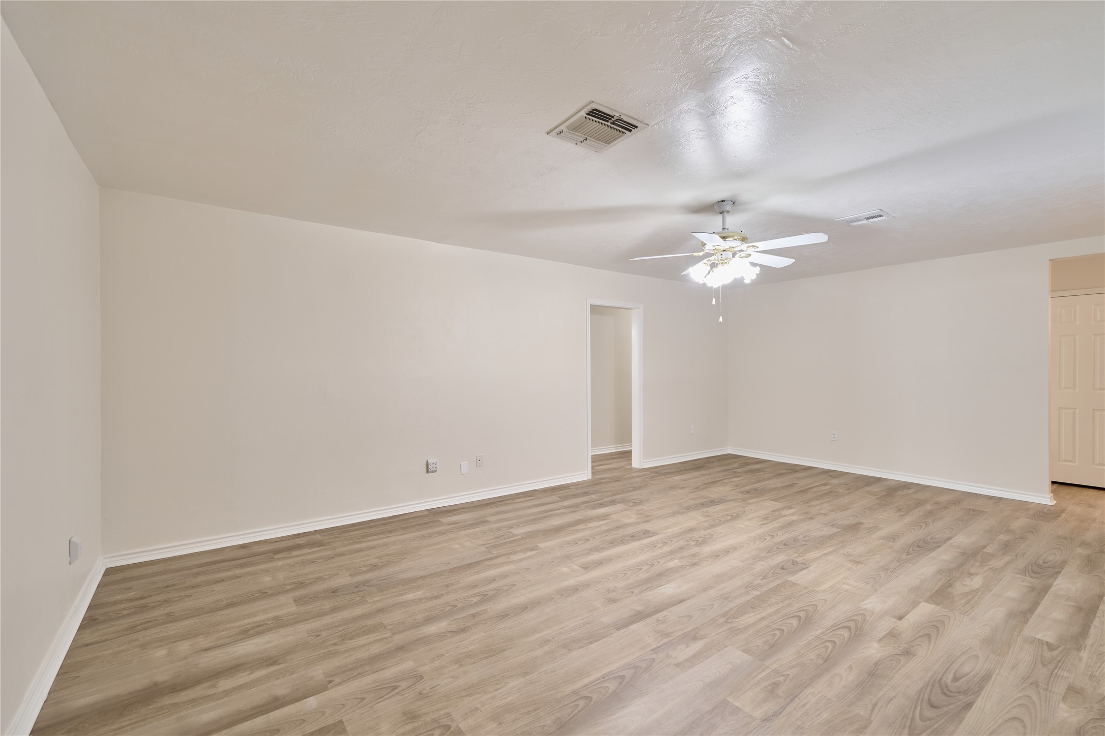 21807 Greengate Drive Spring, TX 77388 - Photo 15 of 44 a view of an empty room with wooden floor