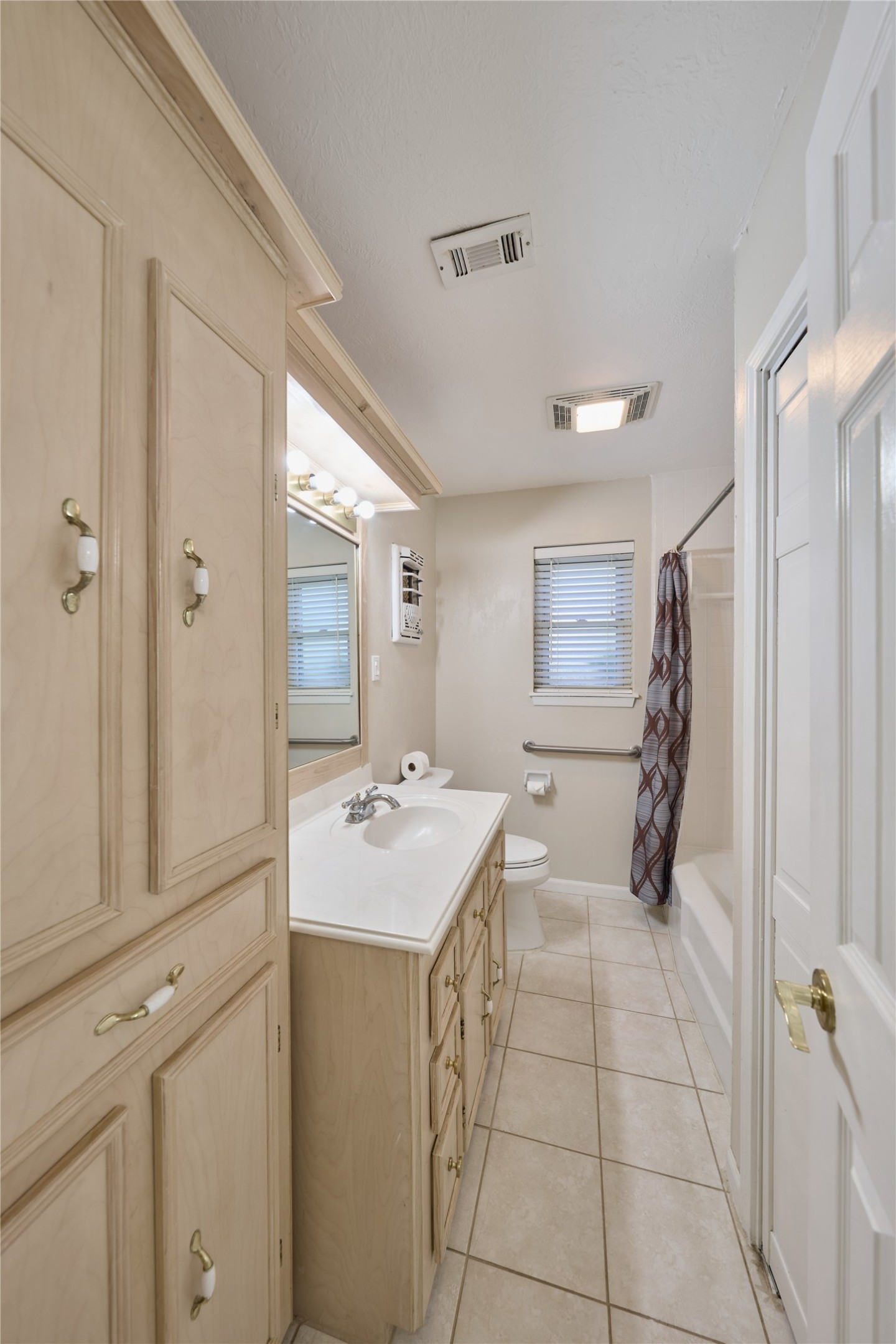 21807 Greengate Drive Spring, TX 77388 - Photo 18 of 44 a bathroom with a sink a toilet and mirror