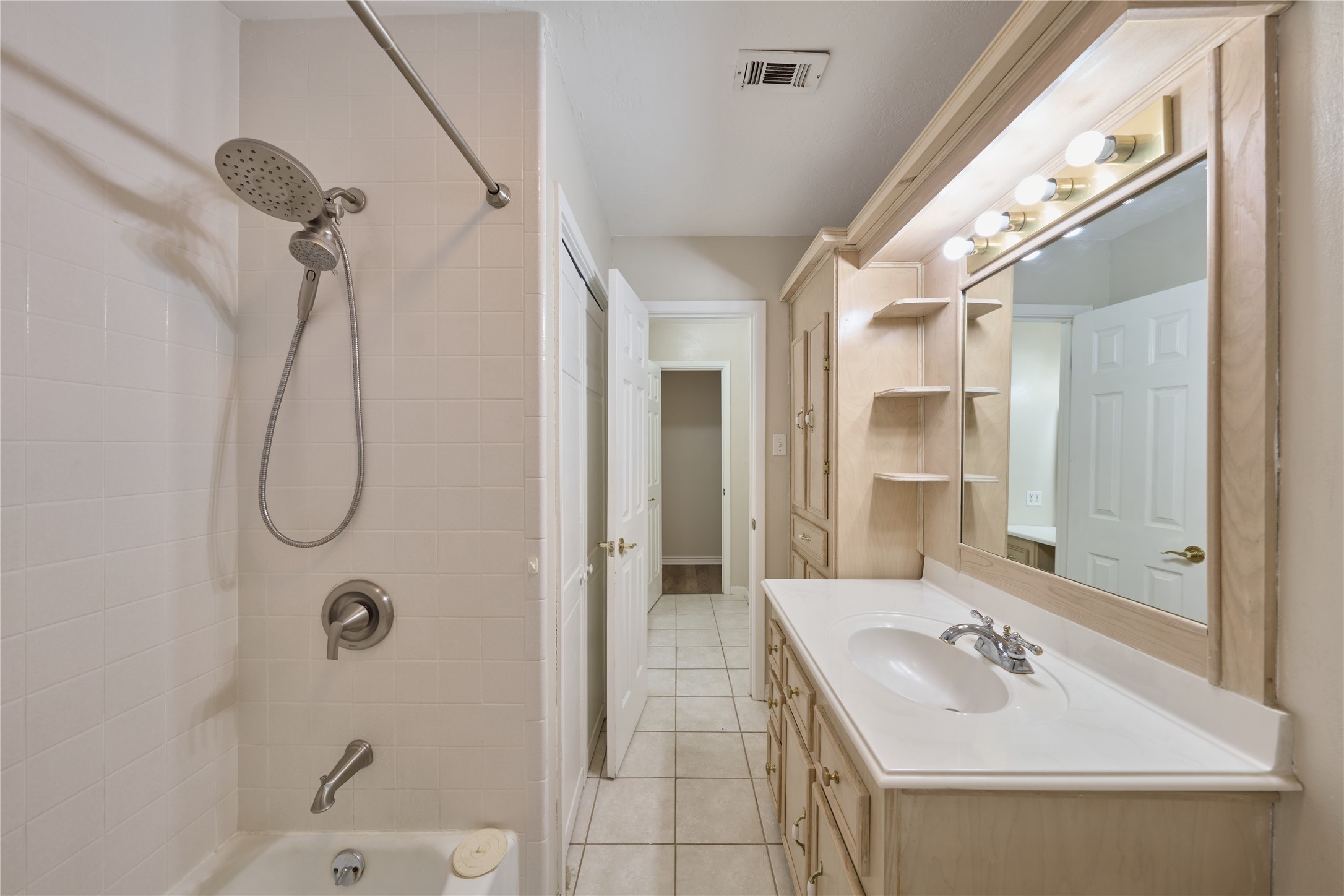 21807 Greengate Drive Spring, TX 77388 - Photo 19 of 44 a bathroom with a sink a shower and a mirror