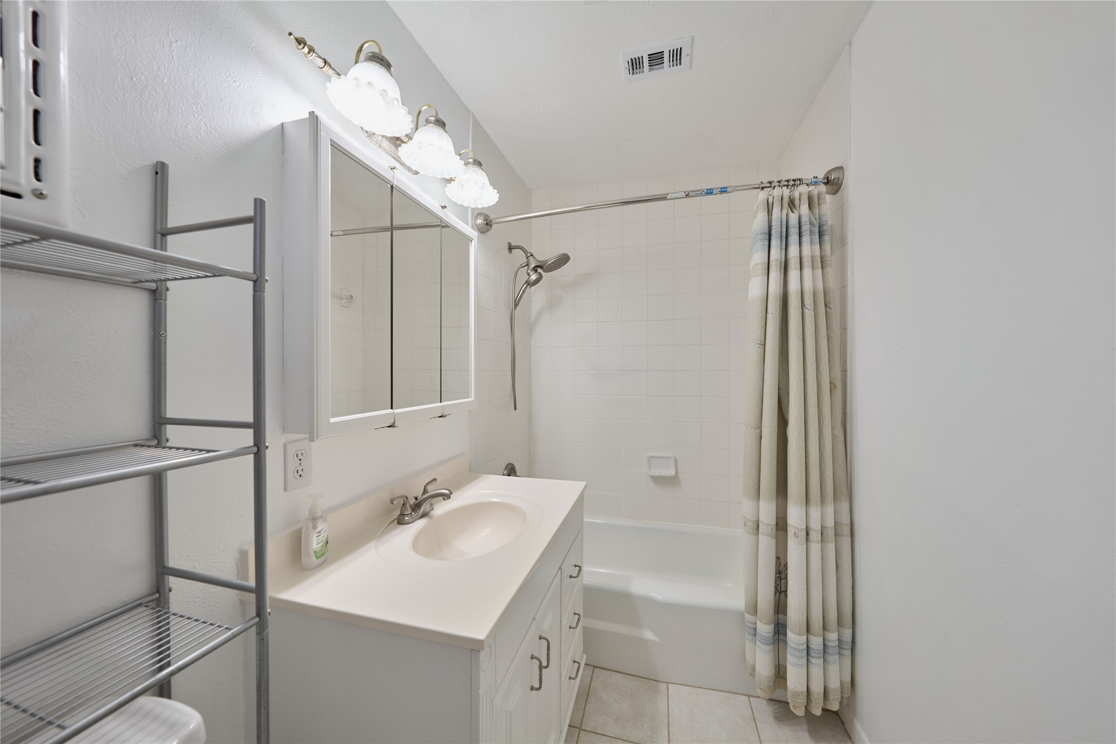 21807 Greengate Drive Spring, TX 77388 - Photo 25 of 44 a bathroom with a granite countertop sink a mirror and shower