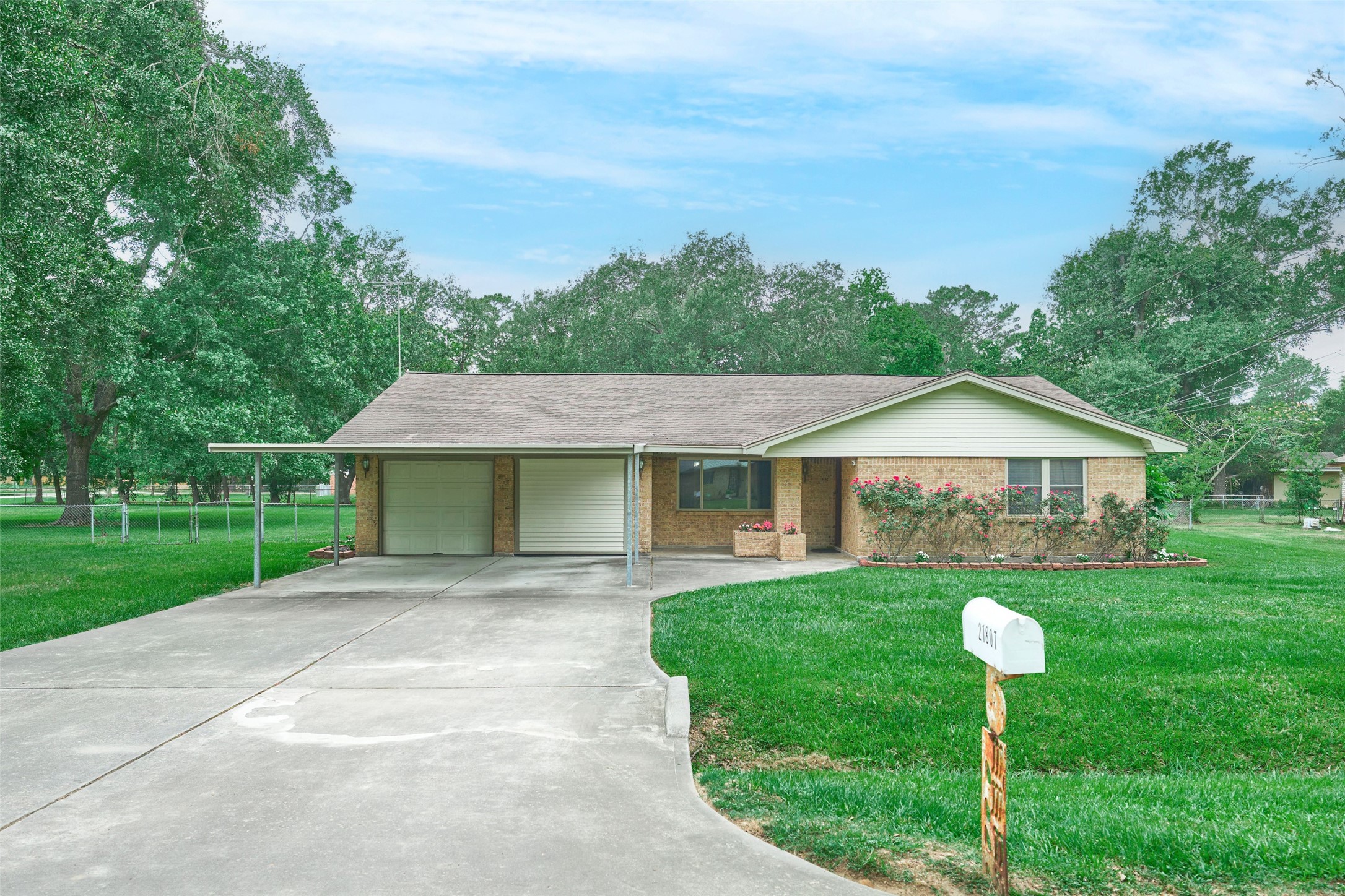 21807 Greengate Drive Spring, TX 77388 - Photo 4 of 44 a front view of a house with a yard and trees
