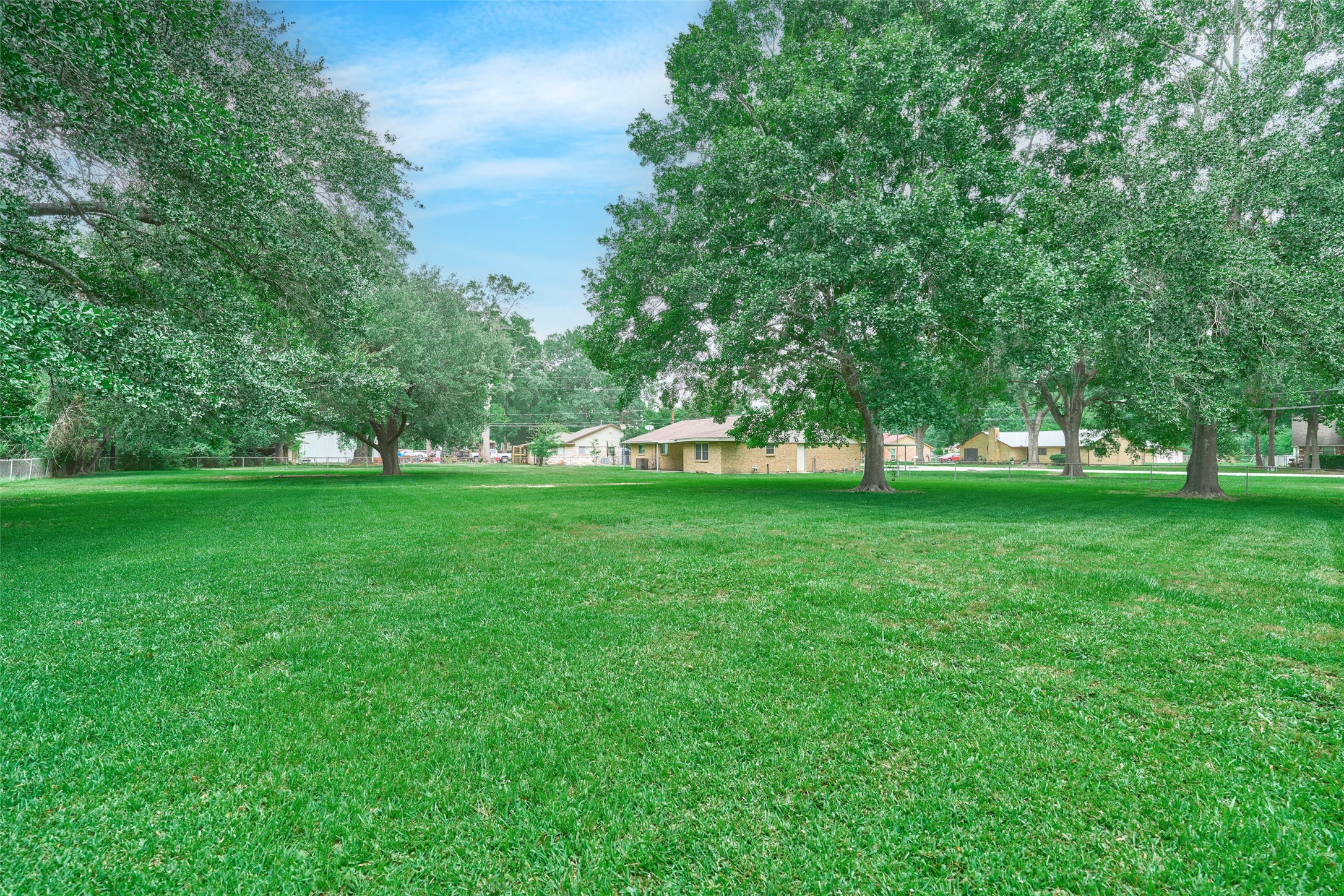 21807 Greengate Drive Spring, TX 77388 - Photo 41 of 44 a view of green field with trees in the background