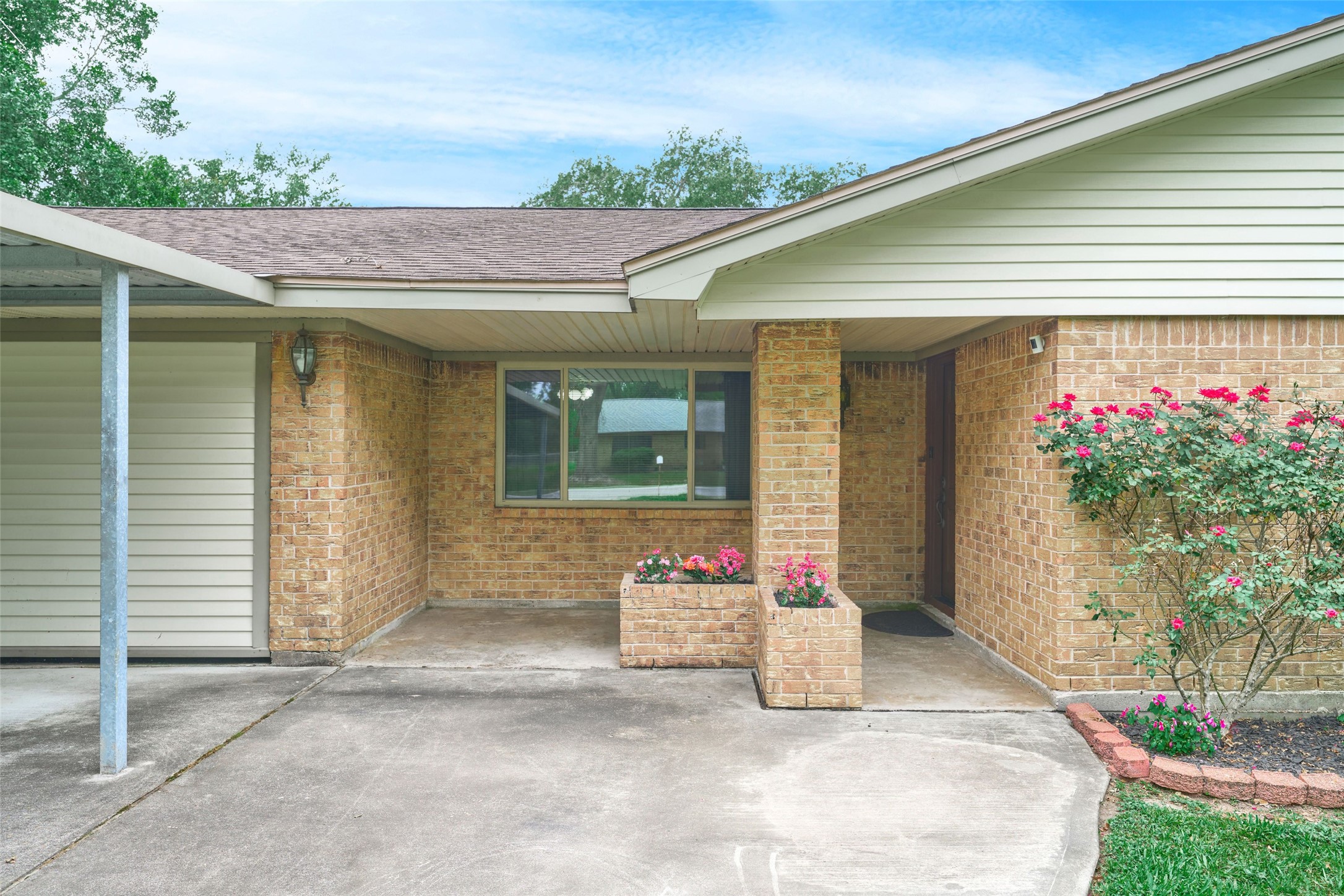 21807 Greengate Drive Spring, TX 77388 - Photo 5 of 44 a front view of a house with flowers