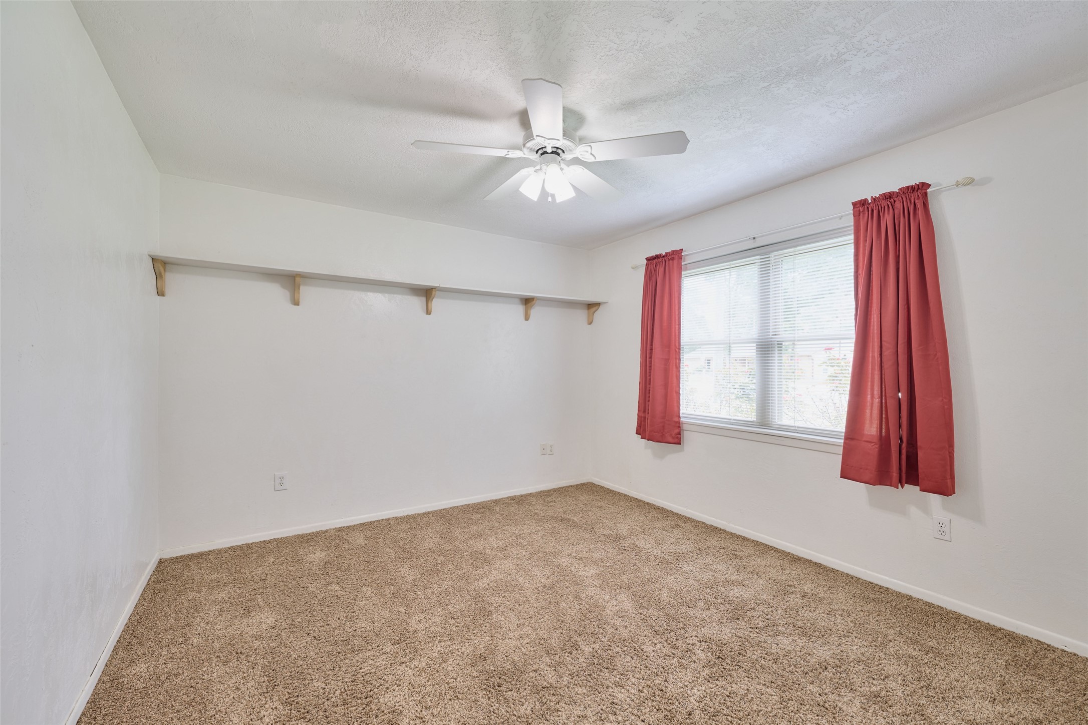 21807 Greengate Drive Spring, TX 77388 - Photo 9 of 44 a view of a livingroom with a ceiling fan and window
