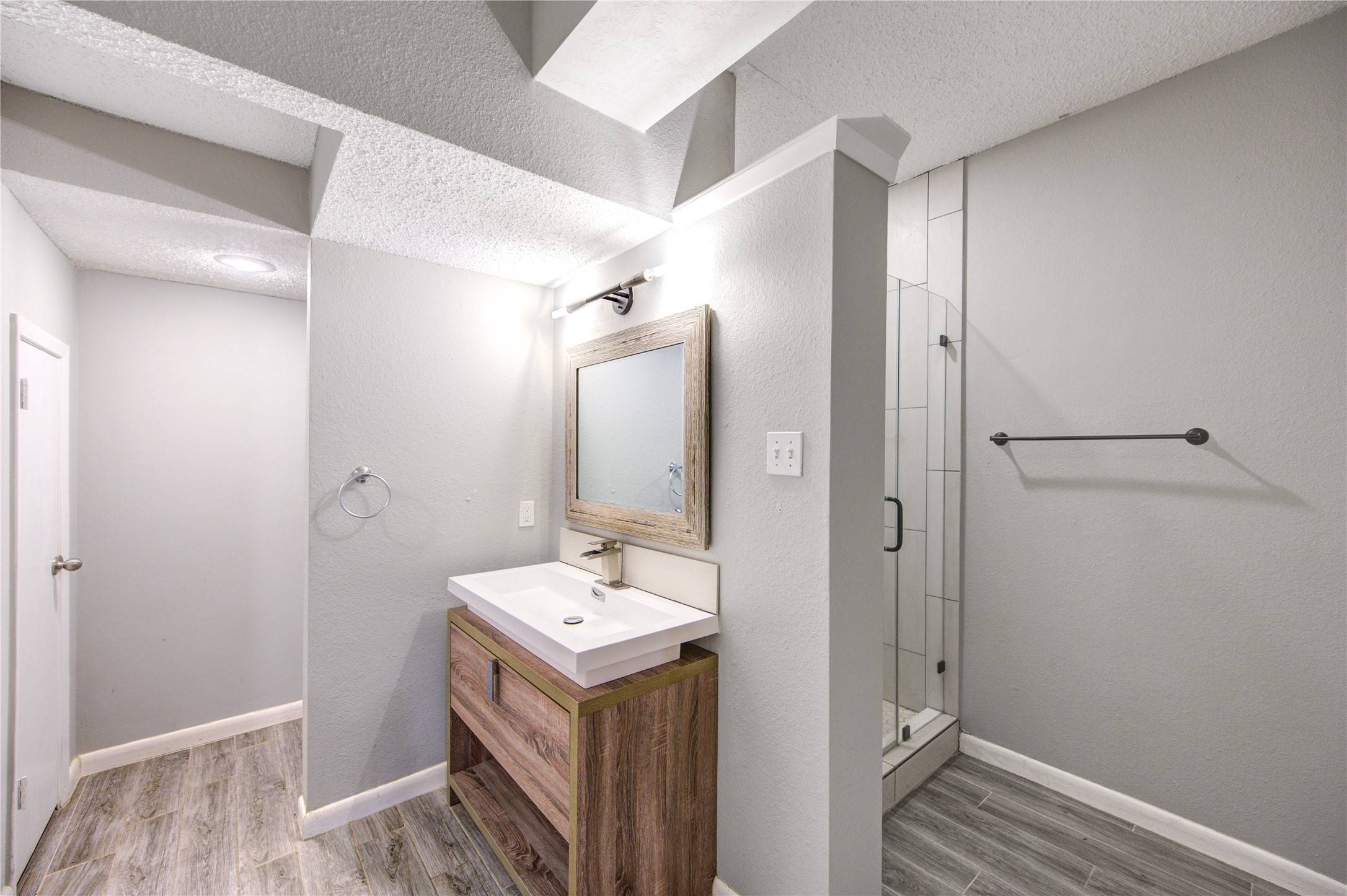 530 Enchanted Lane Spring, TX 77388 - Photo 11 of 26 a bathroom with a sink and mirror with shower