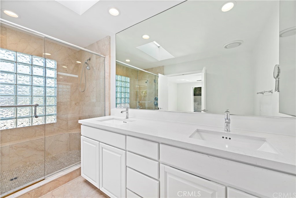 147 Monarch Bay Drive Dana Point, CA 92629 - Photo 13 of 23 a bathroom with a sink and a mirror
