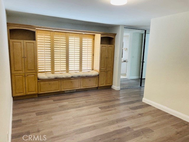 147 Monarch Bay Drive Dana Point, CA 92629 - Photo 17 of 23 an empty room with wooden floor and windows