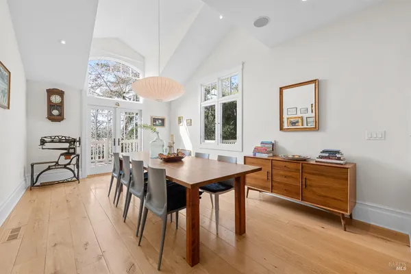 a view of a dining room with furniture and chandelier
