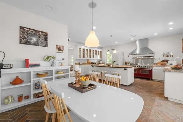 a living room with kitchen island furniture and a wooden floor