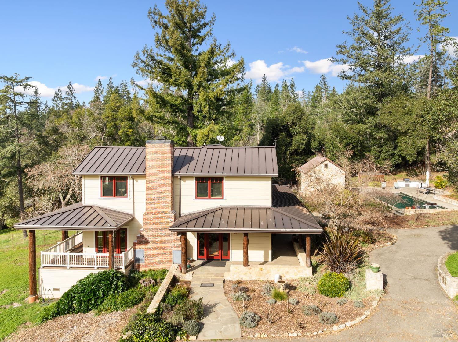 405 Cold Springs Road Angwin, CA 94508 - Photo 3 of 48 a front view of a house with a garden