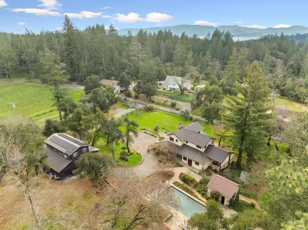 a view of a swimming pool with a yard and mountain view