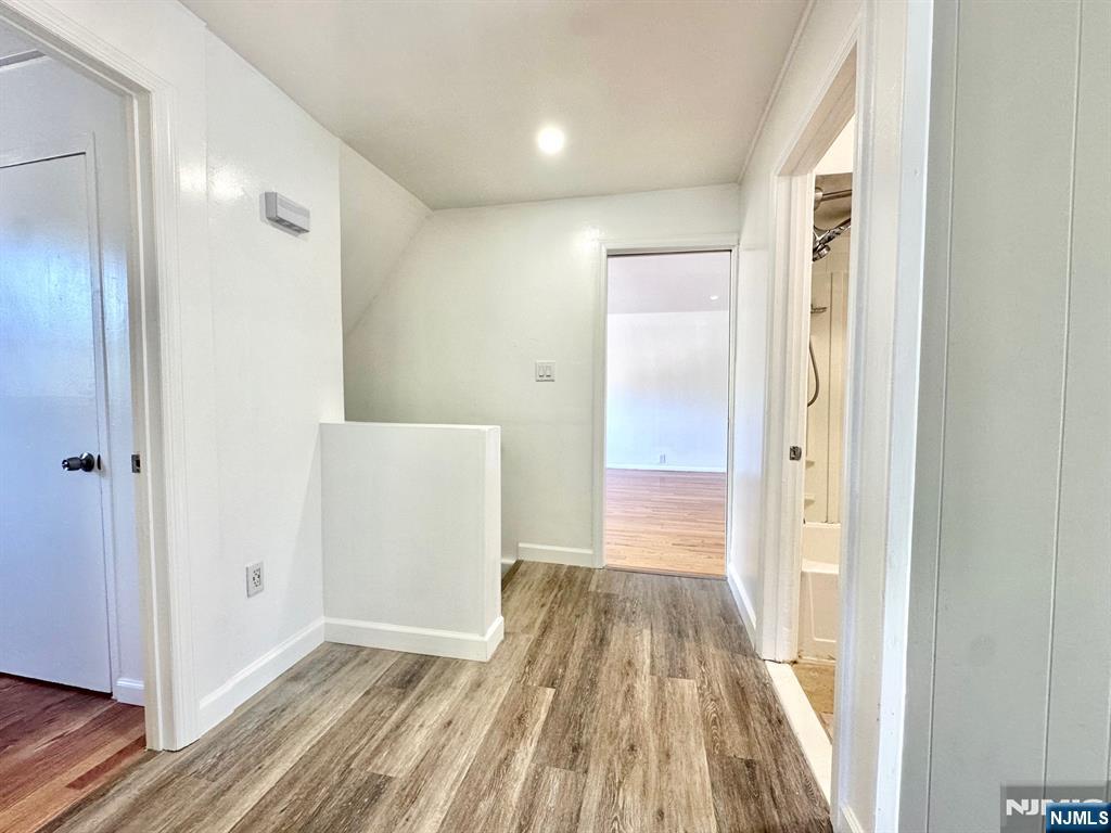 23 Trimble Avenue, Unit 2 Clifton, NJ 07011 - Photo 12 of 16 a view of a hallway view with wooden floor and staircase