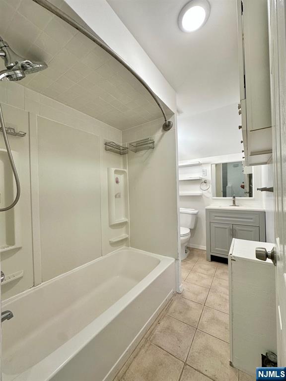 23 Trimble Avenue, Unit 2 Clifton, NJ 07011 - Photo 8 of 16 a bathroom with a sink a bath tub and a glass door shower