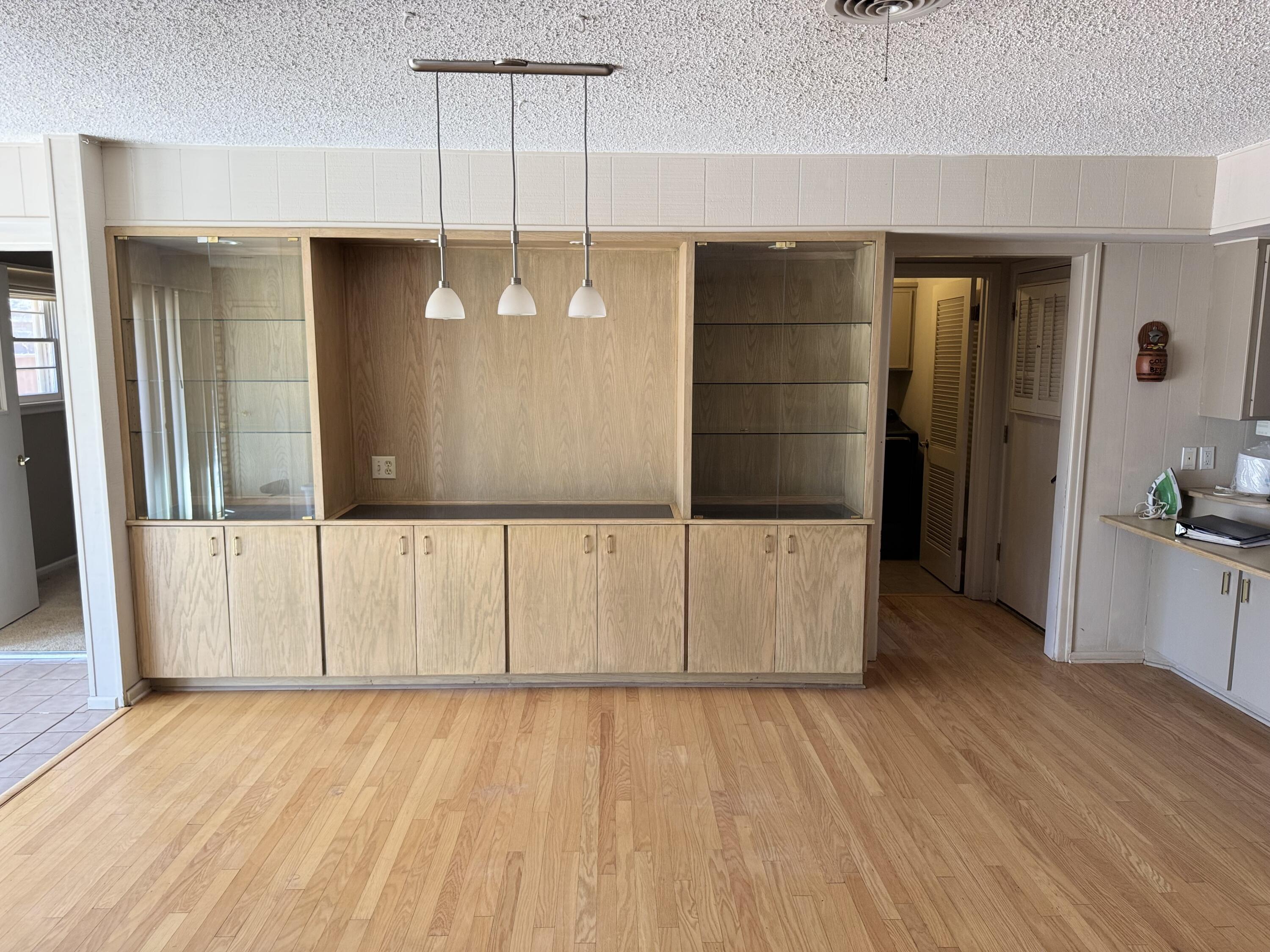 2115 62nd Street Lubbock, TX 79412 - Photo 13 of 15 wooden floor in an empty room with a window