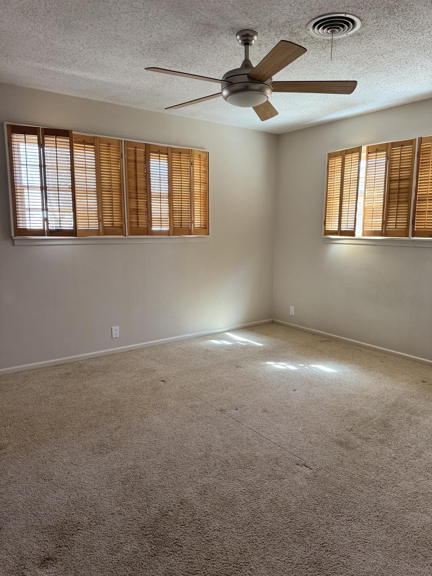 2115 62nd Street Lubbock, TX 79412 - Photo 15 of 15 a view of an empty room with a window