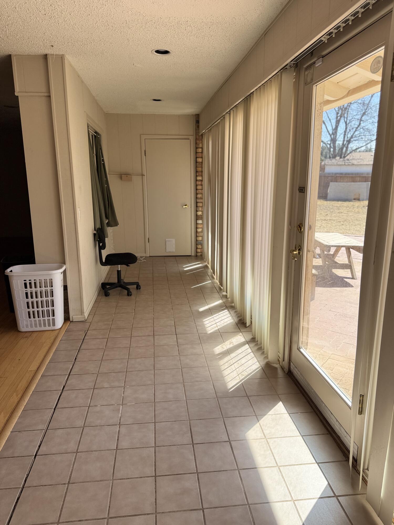 2115 62nd Street Lubbock, TX 79412 - Photo 4 of 15 a view of an empty room with a window