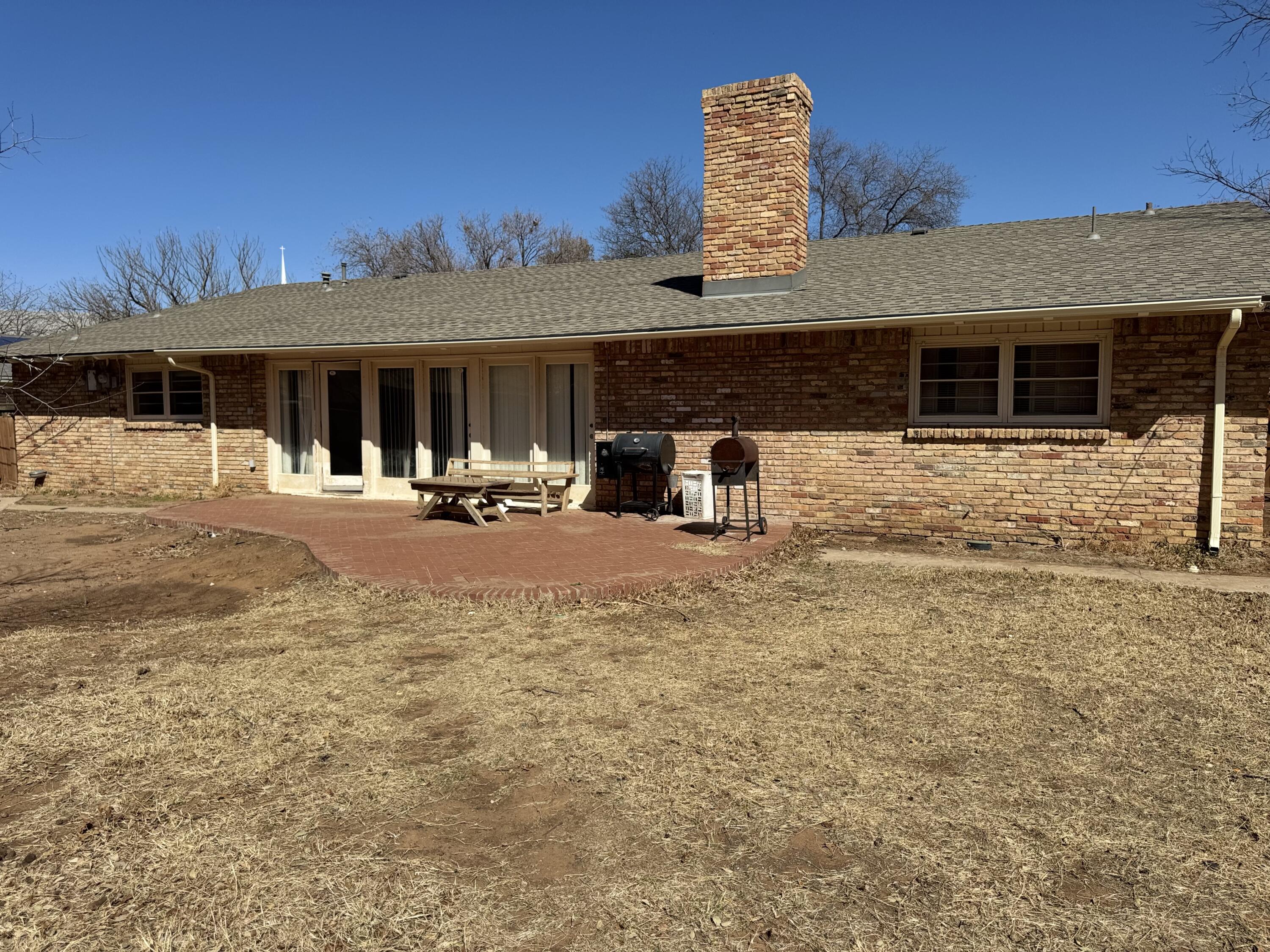 2115 62nd Street Lubbock, TX 79412 - Photo 5 of 15 a view of a house with backyard and sitting area