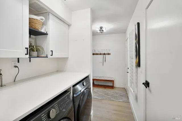 a view of cabinets and wooden floor