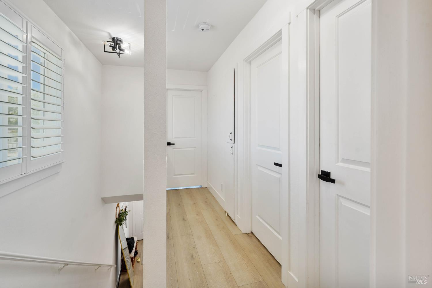 451 37th Street Richmond, CA 94805 - Photo 16 of 36 a view of a hallway with wooden floor and entryway