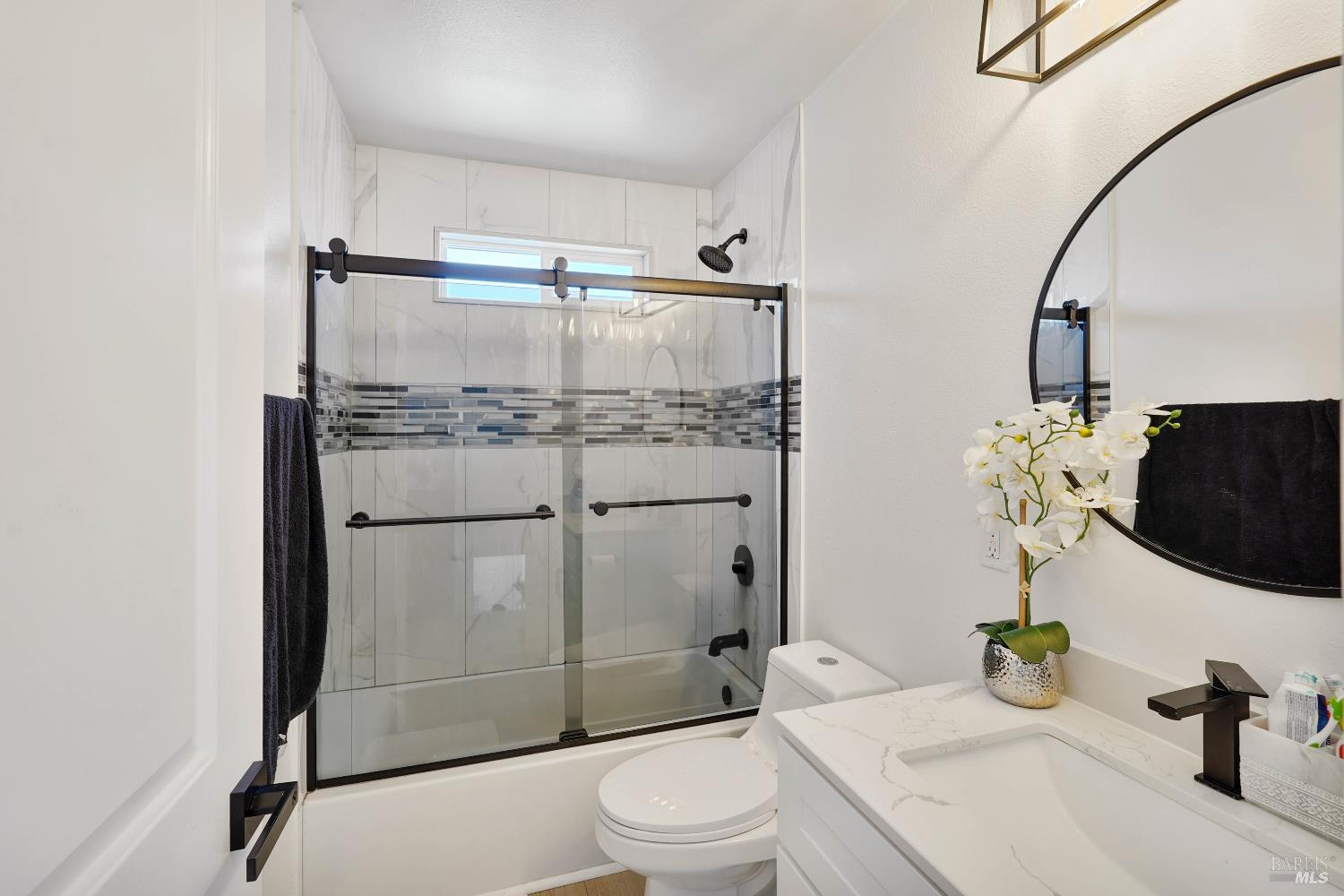 451 37th Street Richmond, CA 94805 - Photo 17 of 36 a bathroom with a sink toilet and shower