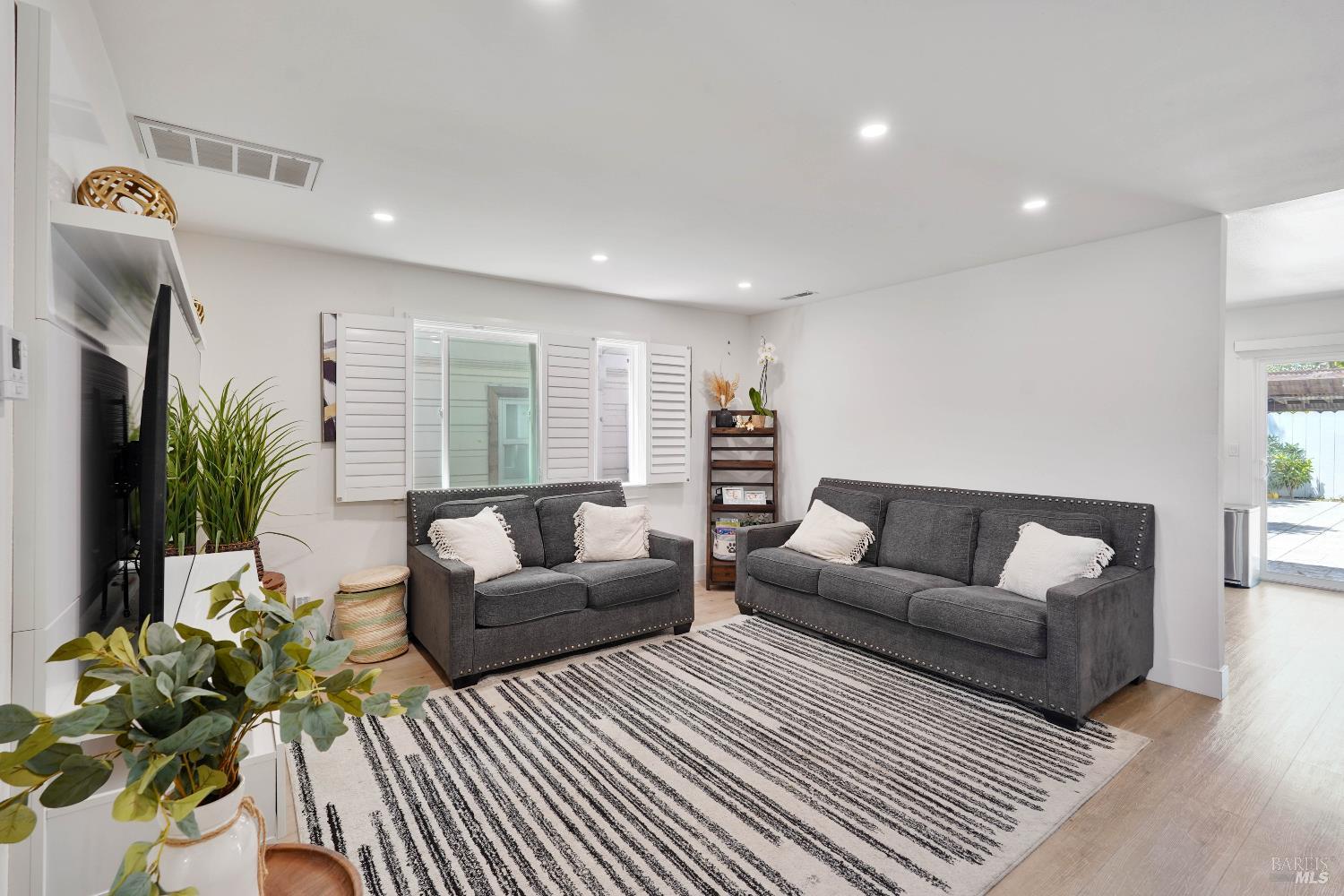 451 37th Street Richmond, CA 94805 - Photo 2 of 36 a living room with furniture and a large window