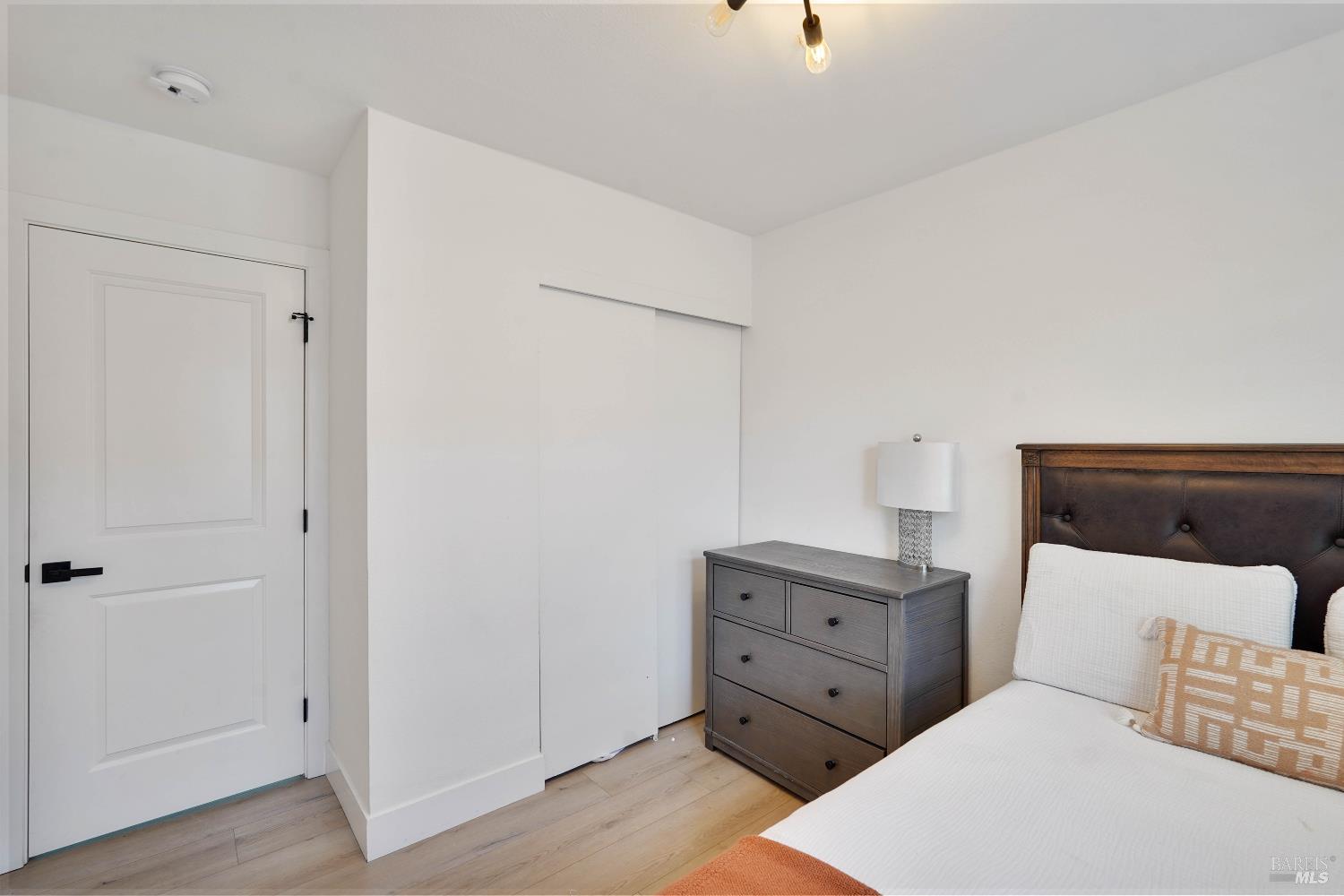 451 37th Street Richmond, CA 94805 - Photo 23 of 36 a living room with furniture and wooden floor