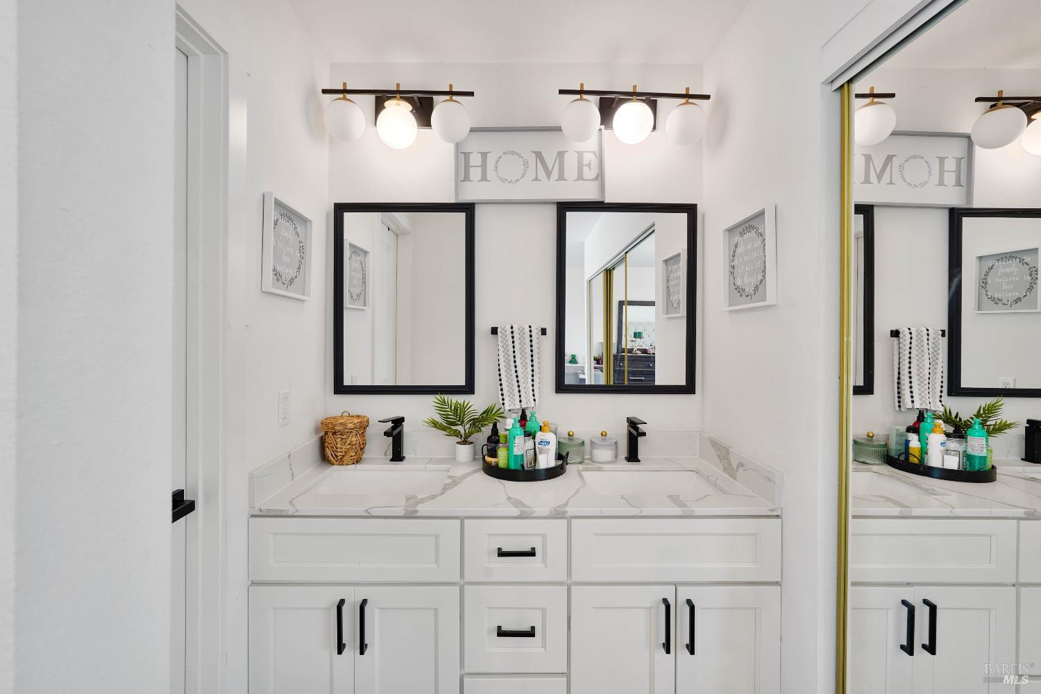 451 37th Street Richmond, CA 94805 - Photo 28 of 36 a bathroom with a sink and a mirror