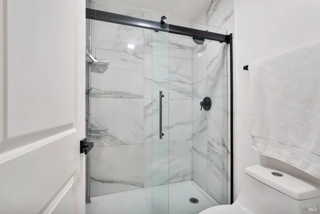 a front view of a house with a yard and a garage