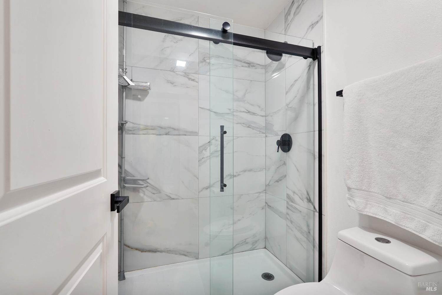 451 37th Street Richmond, CA 94805 - Photo 29 of 36 a bathroom with a shower and toilet