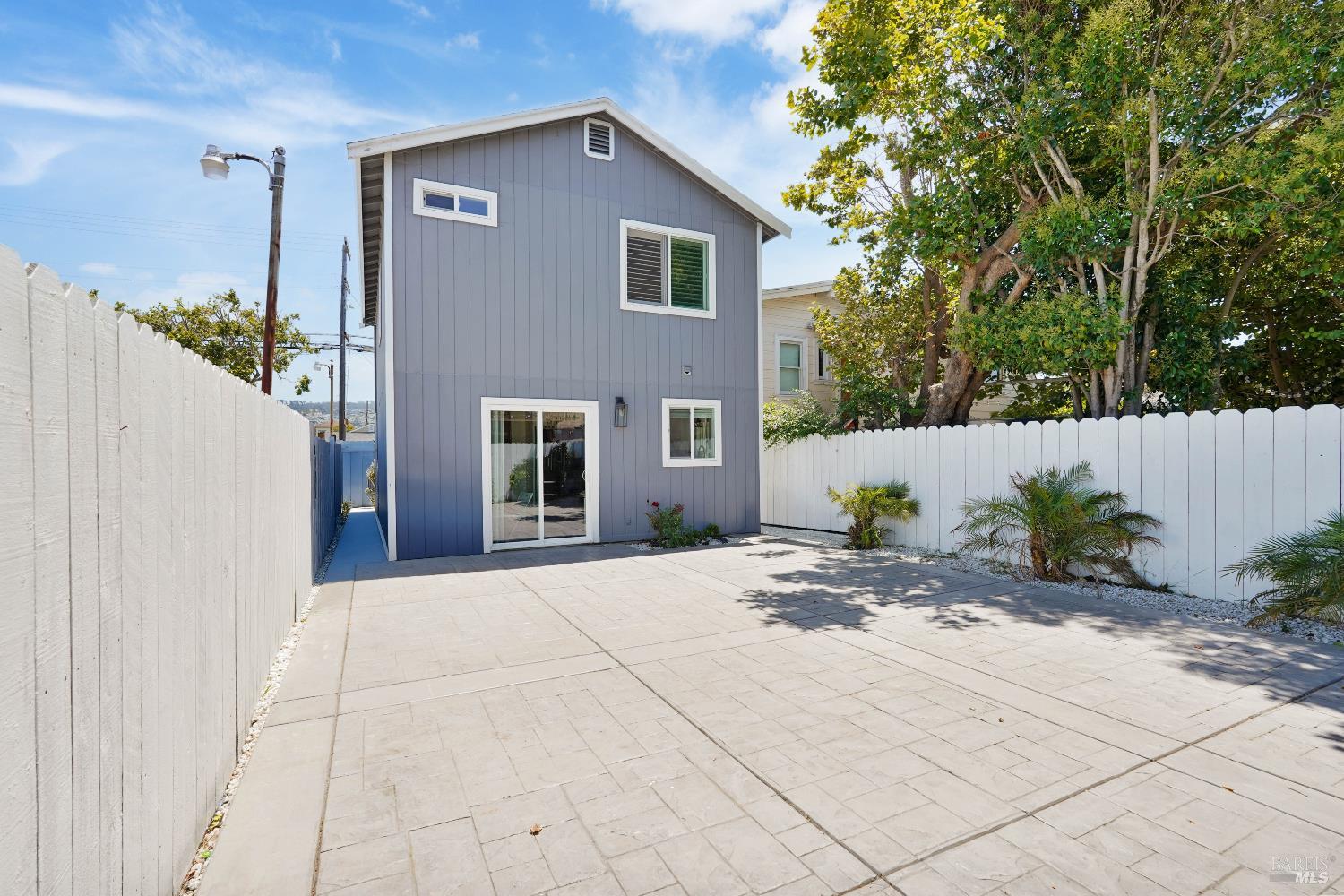 451 37th Street Richmond, CA 94805 - Photo 30 of 36 a front view of a house with a yard and a garage