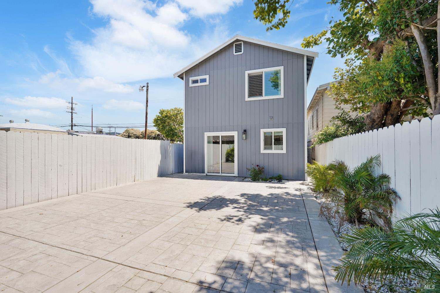 451 37th Street Richmond, CA 94805 - Photo 33 of 36 a front view of a house with a yard