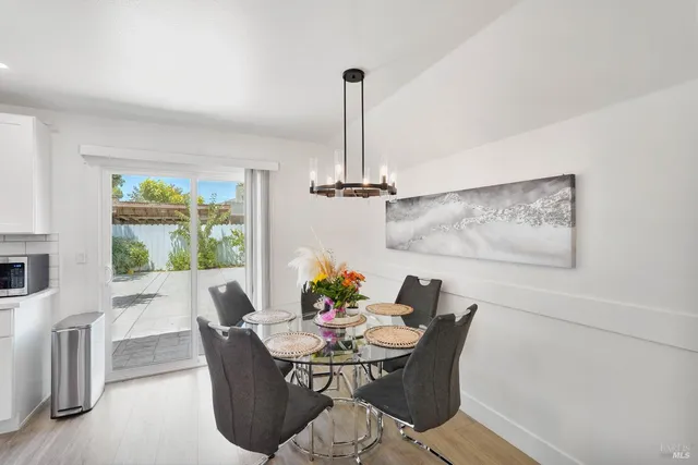 a view of a dining room with furniture window and outside view