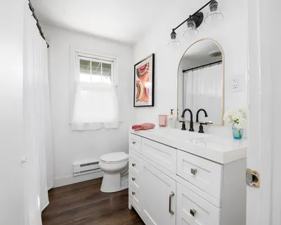 a kitchen with a sink and a toilet