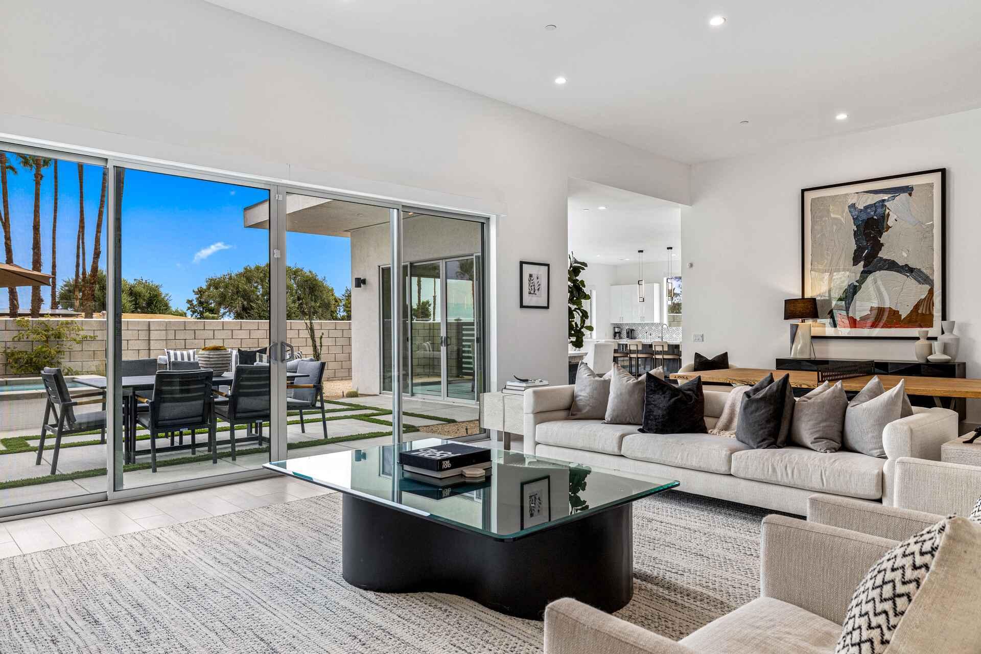 72985 Somera Road Palm Desert, CA 92260 - Photo 5 of 17 a living room with furniture and a large window