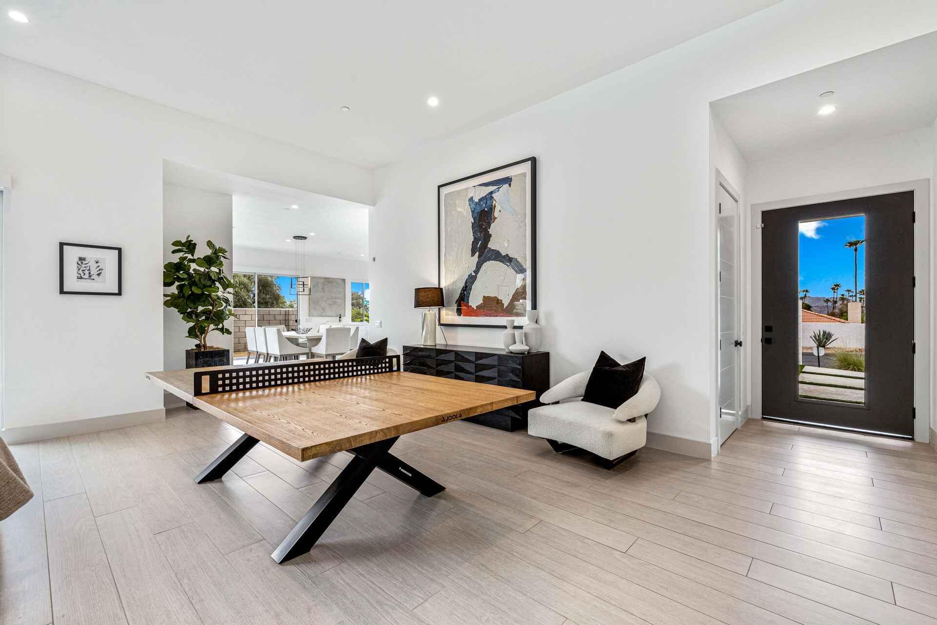 72985 Somera Road Palm Desert, CA 92260 - Photo 6 of 17 a living room with furniture and wooden floor