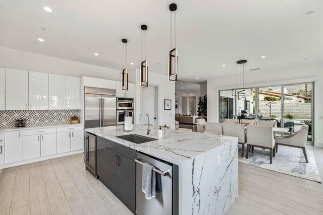 a kitchen with a sink stove and cabinets