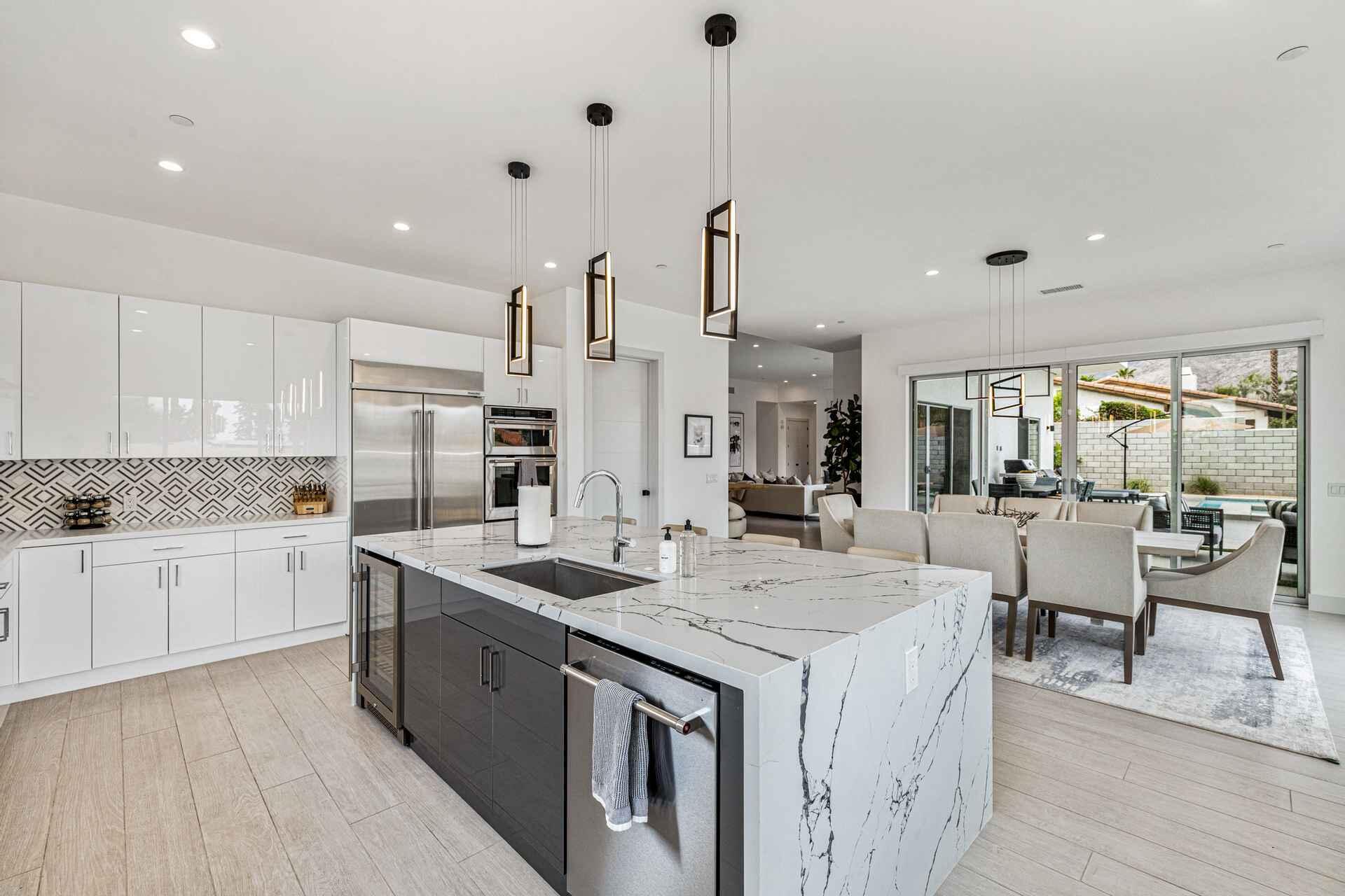 72985 Somera Road Palm Desert, CA 92260 - Photo 9 of 17 a kitchen with a sink stove and cabinets