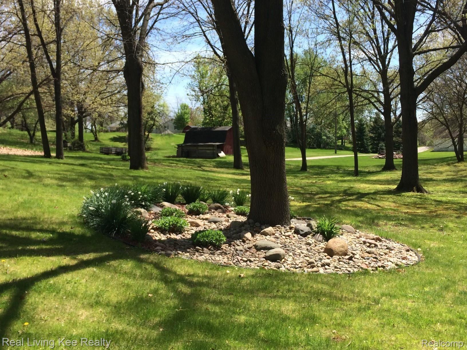3648 Gregory Road Lake Orion, MI 48359 - Photo 65 of 68 Professional landscaped so something is always in bloom.