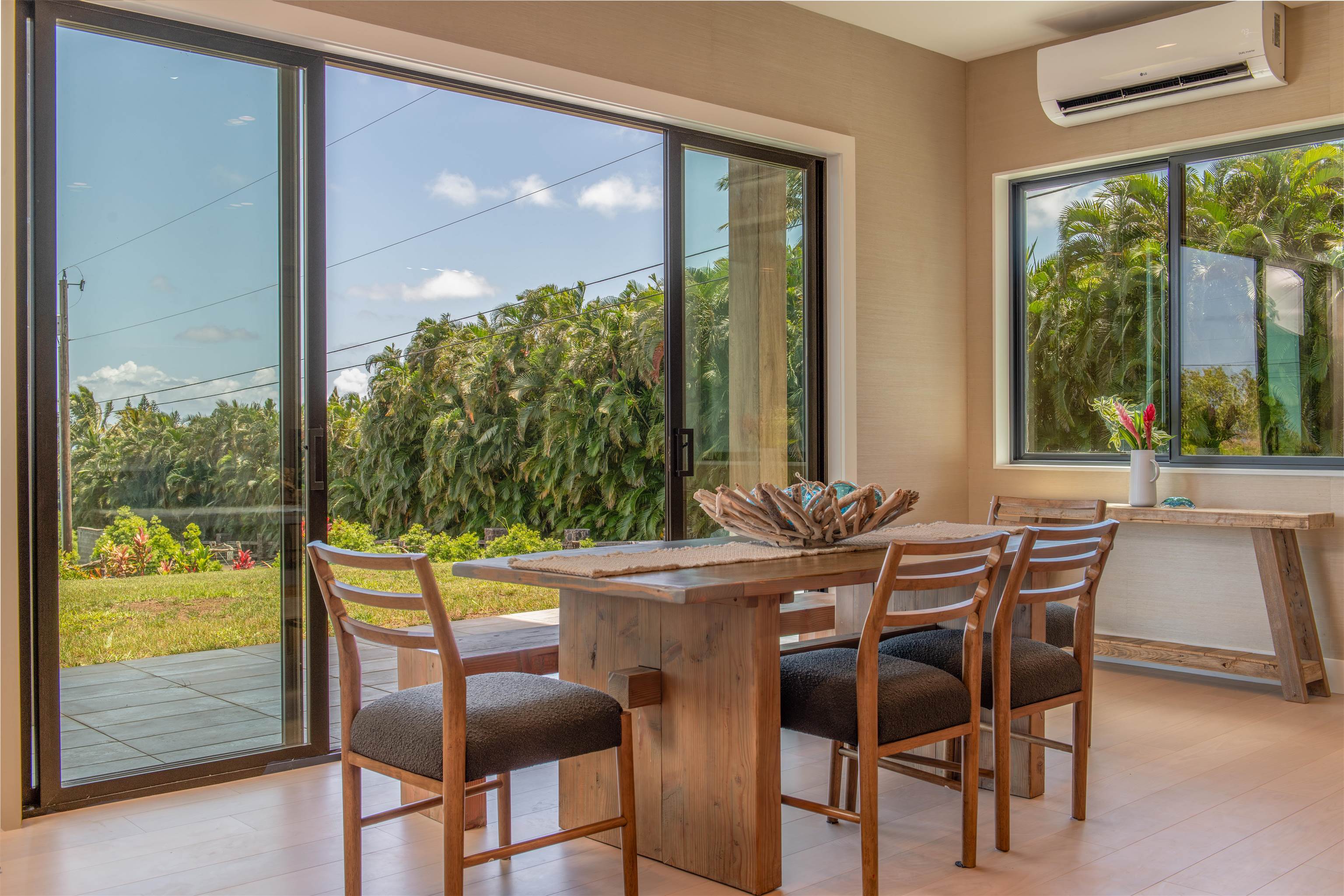 111 Mehana Road, Unit A Haiku, HI 96708 - Photo 25 of 50 a dining room with furniture and window
