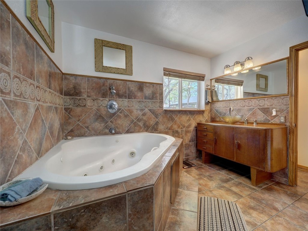 202 Sunset Ingleside, TX 78362 - Photo 13 of 40 a bathroom with a tub and a sink