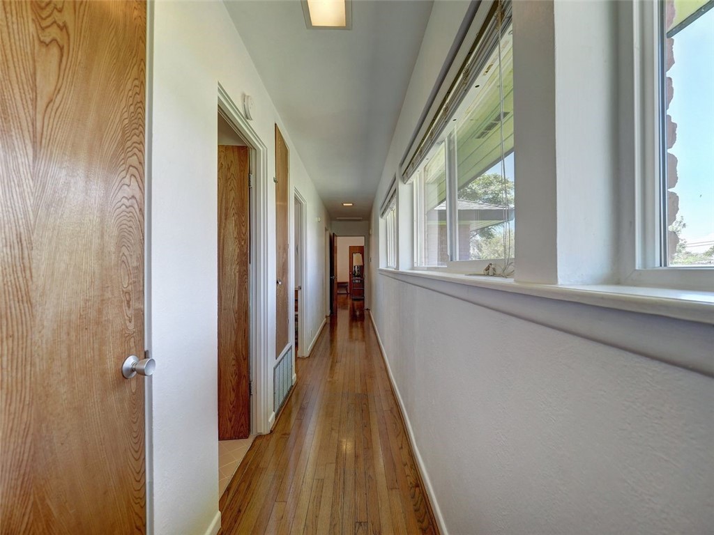202 Sunset Ingleside, TX 78362 - Photo 16 of 40 a view of a hallway with wooden floor and staircase