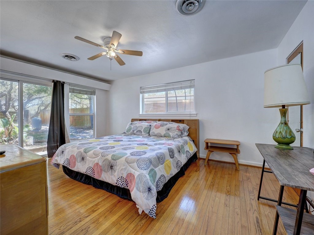 202 Sunset Ingleside, TX 78362 - Photo 17 of 40 a bedroom with bed and wooden floor