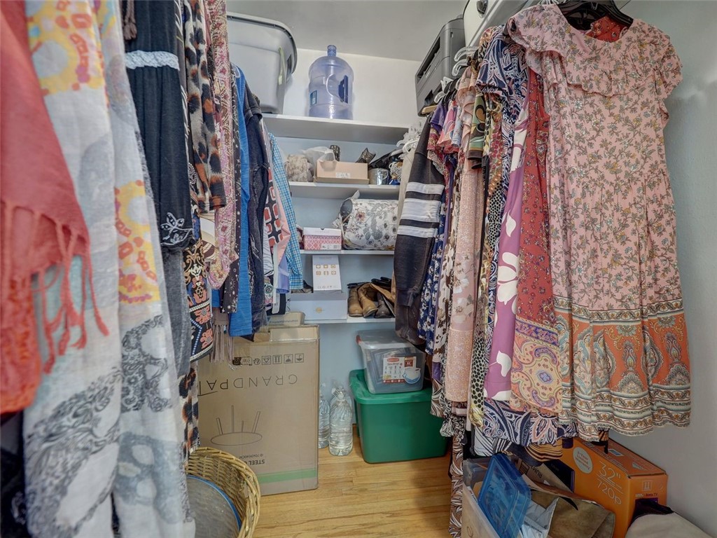202 Sunset Ingleside, TX 78362 - Photo 19 of 40 a view of walk in closet with clothes and shoes