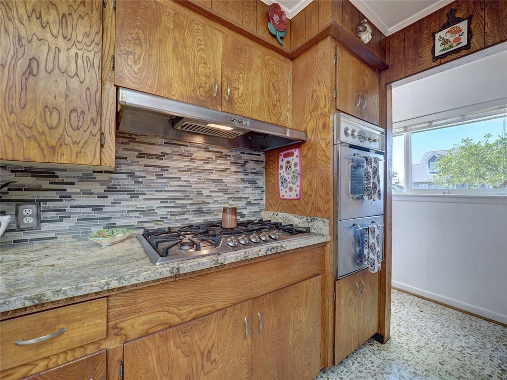 202 Sunset Ingleside, TX 78362 - Photo 3 of 40 a kitchen with stainless steel appliances granite countertop a sink and a stove